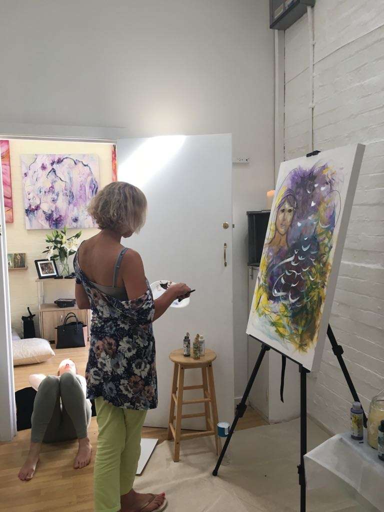 Denise Chilton painting self-portrait