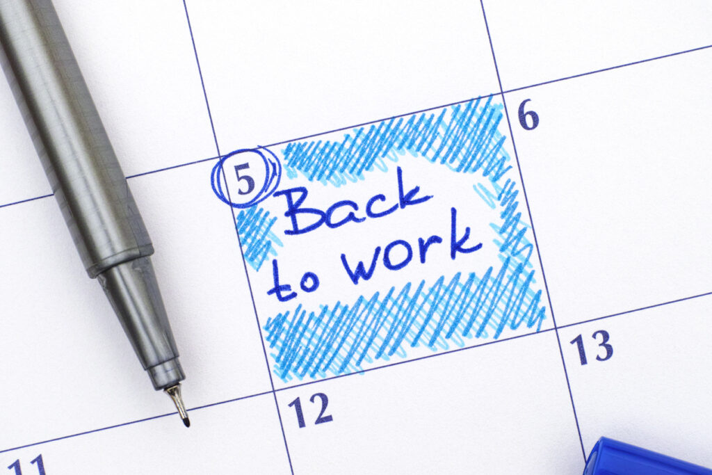 Back to Work in calendar with blue pen.
